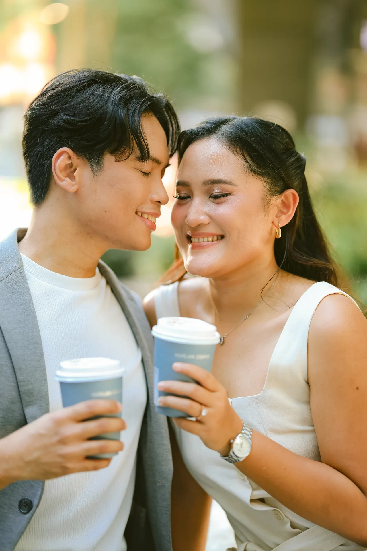Stephen and Michelle leaning close together with their coffee cups